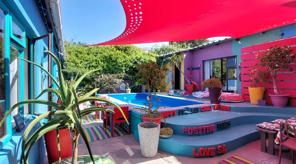 Vibrant swimming pool area, Cape Agulhas Backpackers; Struisbaai, South Africa